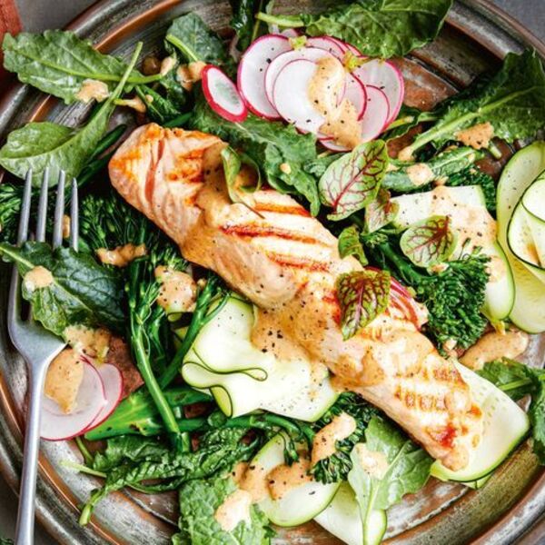 Healthy salmon and zucchini salad with almond dressing